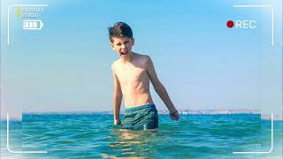 13 years old boy swimming and relaxation in the sea waves