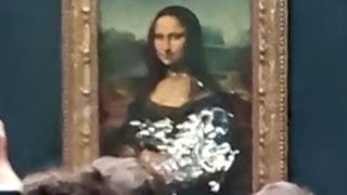 Climate protester throws cake at Mona Lisa painting