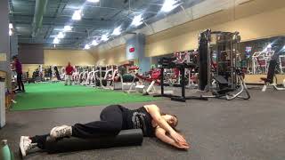 Windmill stretch on a foam roller