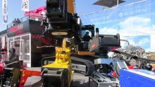 Intermat Paris 2015 Great Operator Picks up pen.