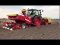 Pneumatic seeder ps 800 spreading fertilizer while planting potatoes