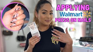 Applying Walmart press on nails for an event 🫣