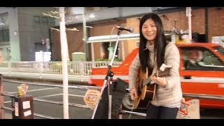 Natsumi (菜摘美) sings next to Gotanda station in Tokyo