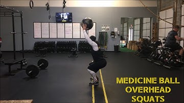 MEDICINE BALL OVERHEAD SQUATS
