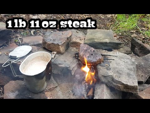 BUSHCRAFT COOKING, open campfire cooking a massive pice of steak in the