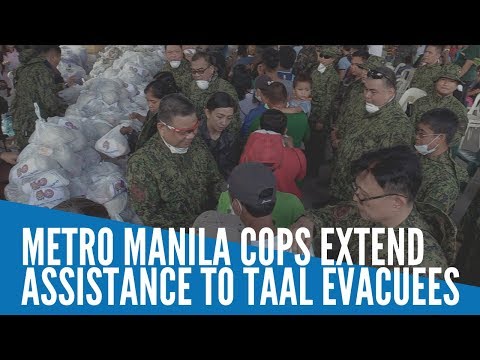 Metro Manila police officers extend assistance to Taal evacuees