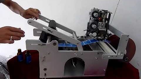 semi automatic round bottle labeling machine with batch coding  Naveena packagings(N-PACK)