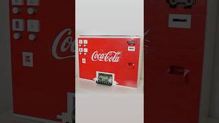 Buying cans of Coke from the Ultimate Lego Coca-Cola Machine