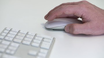 Magic mouse clicking and Apple keyboard | Royalty free Mac video