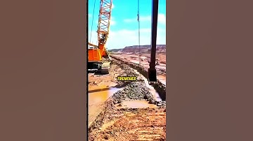 The Process Of Digging A Deep Trench With An Excavator