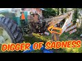 Digger of sadness fixing a 3pt backhoe attachment