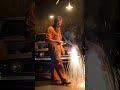 Crazy mechanic walks around the welding broken car