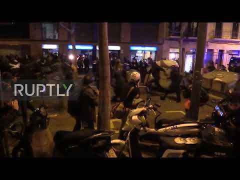 Spain: Police officer strikes protester with baton amid clashes outside Camp Nou