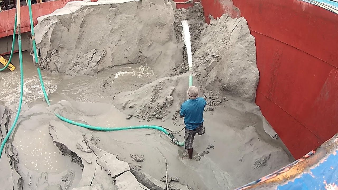 Raw Power of Water: Skilled Worker Blasting Tons of Sand on a Barge!