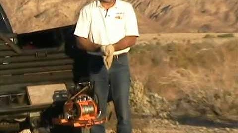 Lewis Winch snatch block demo, huge log skid. Double the pulling power of a portable winch.