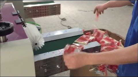 How to adjust the product position in flow packing machine