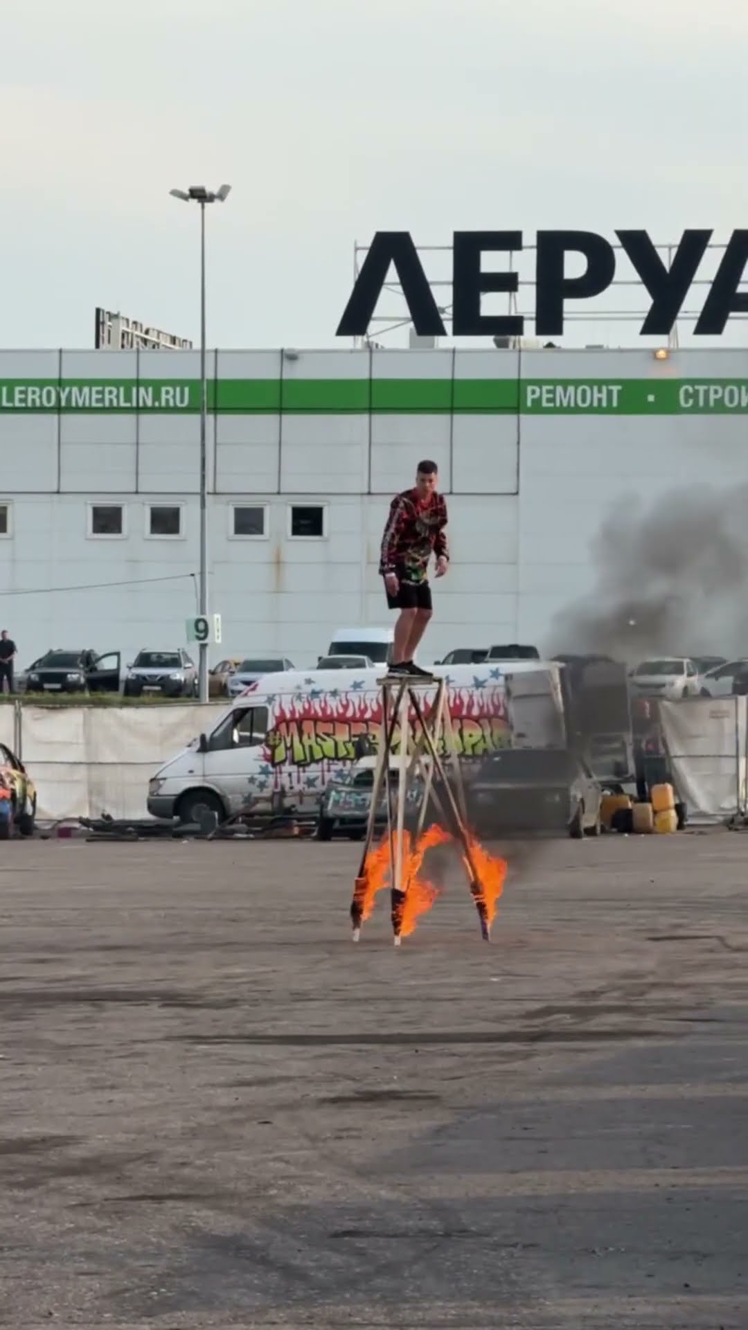 Stuntman Somersaults off Burning Platform and Over a Moving Car