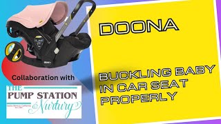 Buckling Baby in Doona Infant Car Seat