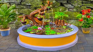 DIY a beautiful waterfall aquarium from cement for your garden corner