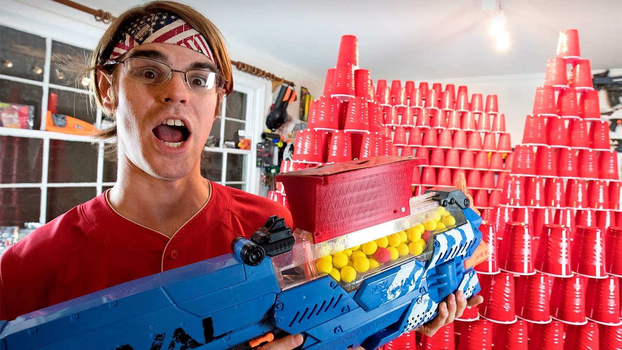 ⁣Worlds Greatest Nerf Gun VS. OVER 1001 Cups (Ft. Aaron Esser)