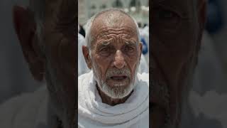 Volunteers Help an Elderly Pilgrim Continue Hajj