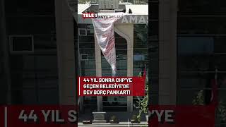 MHP'den CHP'ye geçen belediyeye dev borç pankartı asıldı