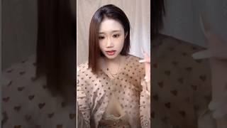 Young woman in a low-cut spaghetti strap top with a plunging neckline | Showing off soft, outward...