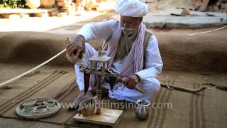 Poppy seed being prepared and opiates consumed by Bishnoi villager in Rajasthan