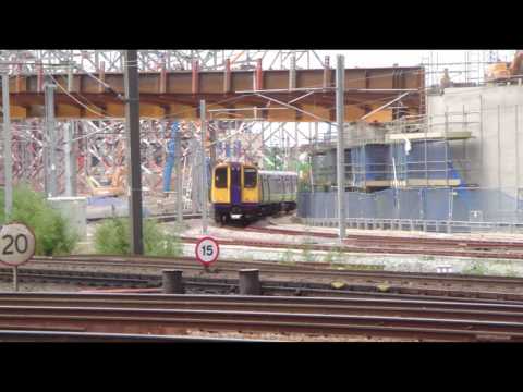 Fast passenger trains at Stratford Station London UK. You can see the 2012 Olympic site in the background. The Central line & DLR can also be seen along with the newly named Overground but before it got its new purpose built trains.