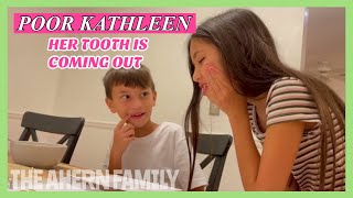 POOR KATHLEEN.. HER TOOTH IS COMING OUT!!!