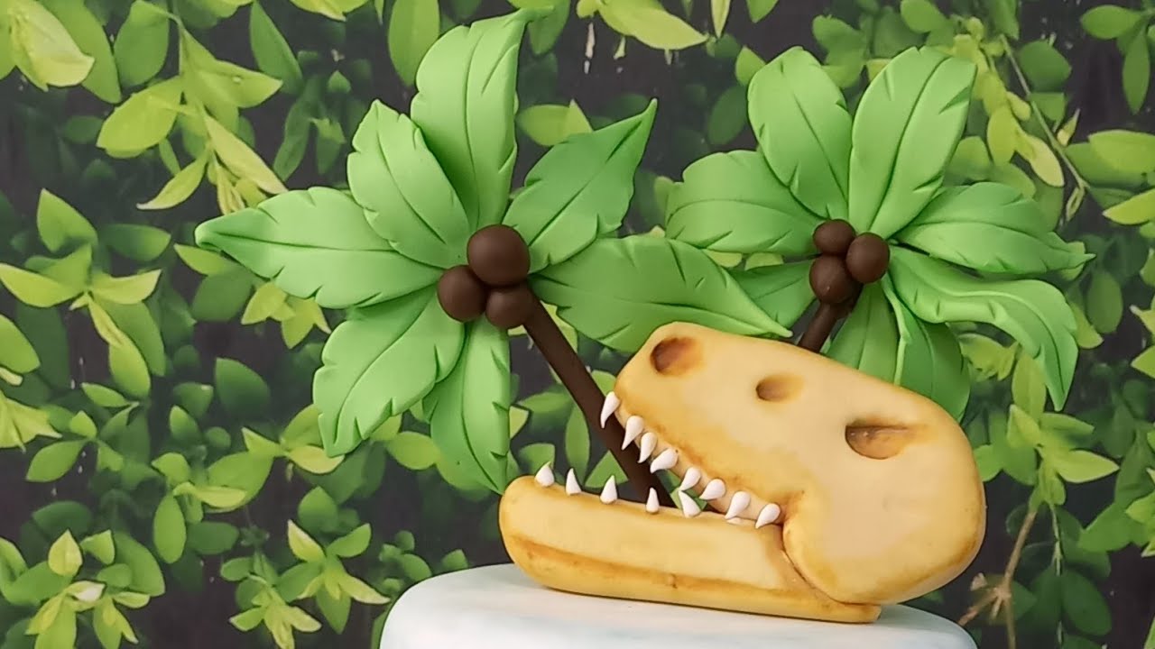 topo de  bolo dinossauro em biscuit