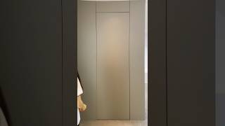 Integrated door-wall seamless design creates a unified wall aesthetic #doors #wooddesigner #wood