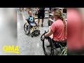 Little boy asks woman in wheelchair how to do wheelies, sparks sweet friendship