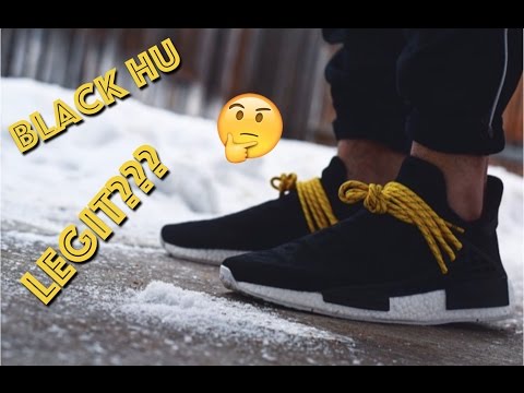 black and yellow human race shoes