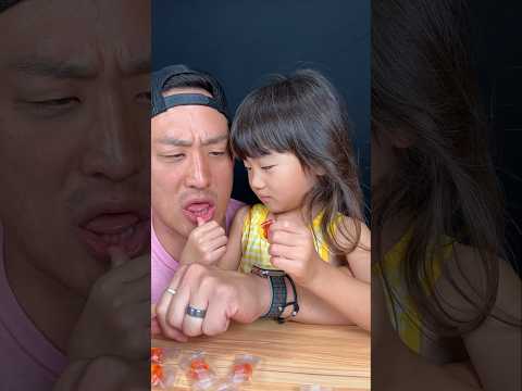 Peeling peach gummies from Korea - her first time trying