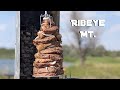 Vertical Rotisserie Ribeye Mountain. Steak at the Lake with Bakes Foods