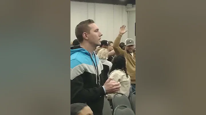 Daniel Adams moves through the crowd with Holy Gho...