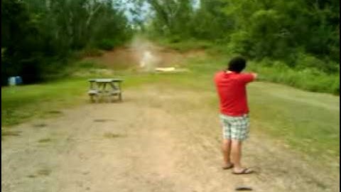 Muggy shooting a gun.