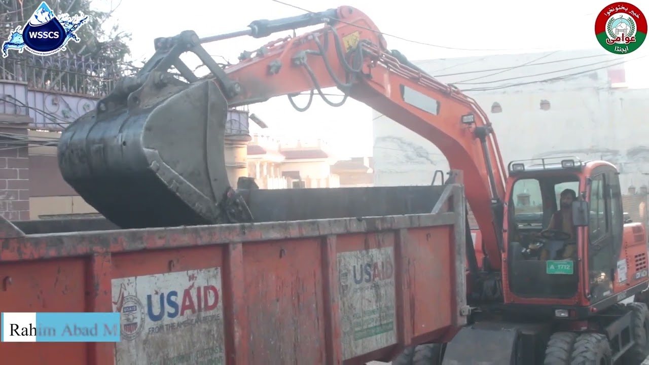 WSSC Swat  Sanitation team is cleaning drains with heavy machinery.
