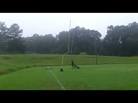 Southeast Guilford High School football practice, Falcons flying around and doing the strectching.
