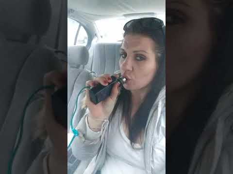 Girl smoking vape...cloud of smoke