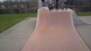 back flip on skates on half pipe
