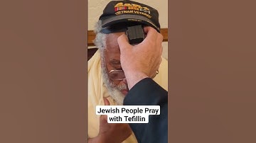 Thumbnail of Jewish people pray wearing prayer boxes, tefillin, which are filled with handwritten scrolls