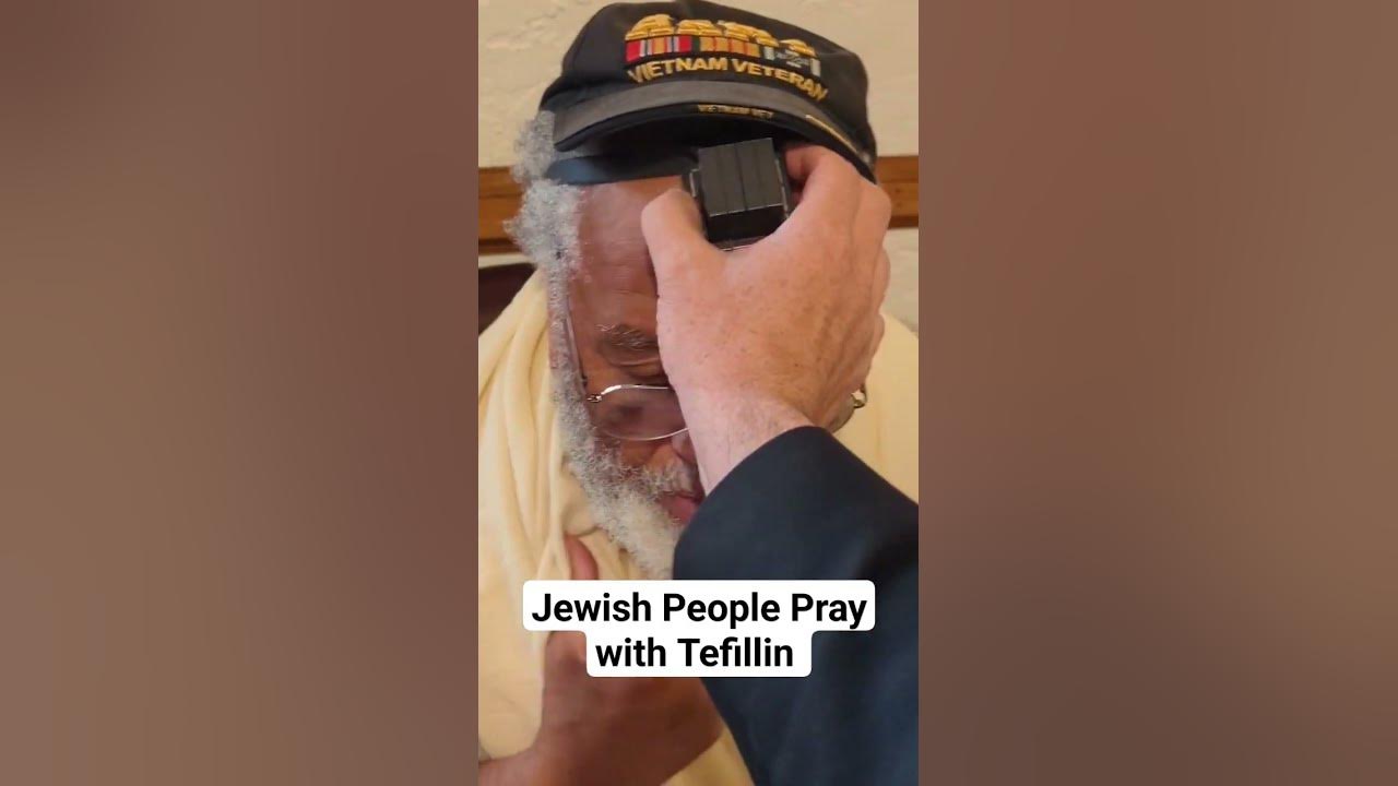 Jewish people pray wearing prayer boxes, tefillin, which are filled with handwritten scrolls