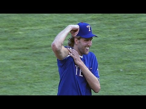 Dallas Mavericks NBA Finals MVP Dirk Nowitzki throws out the first pitch  before the game between the New York Mets and Texas Rangers at Rangers  Ballpark in Arlington, Texas, Friday, June 24