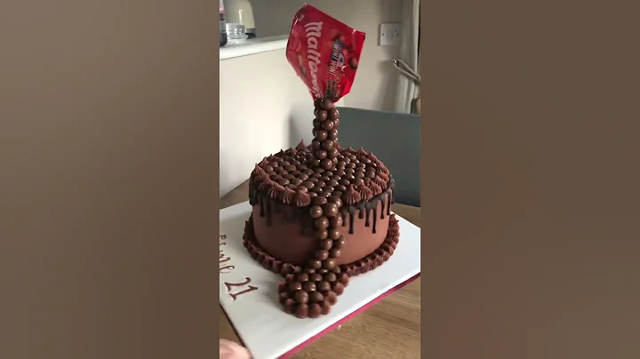 Gravity defying pouring maltesers chocolate birthd...