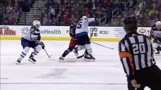 Matt Hendricks lays a big hit on Brandon Dubinsky