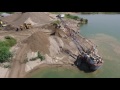 Northwest 9570 dragline dipping out sand out of water.