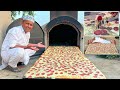 Biggest pepperoni pizza in a huge mud oven  mubashir saddique  village food secrets