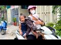 Baby Kim is riding a motorbike with Mom to pick up Diem from school
